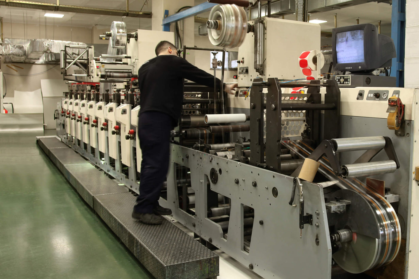 Man managing a custom label machine