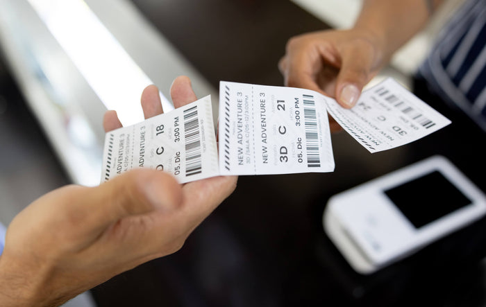 Barcode labels being pulled apart by two hands